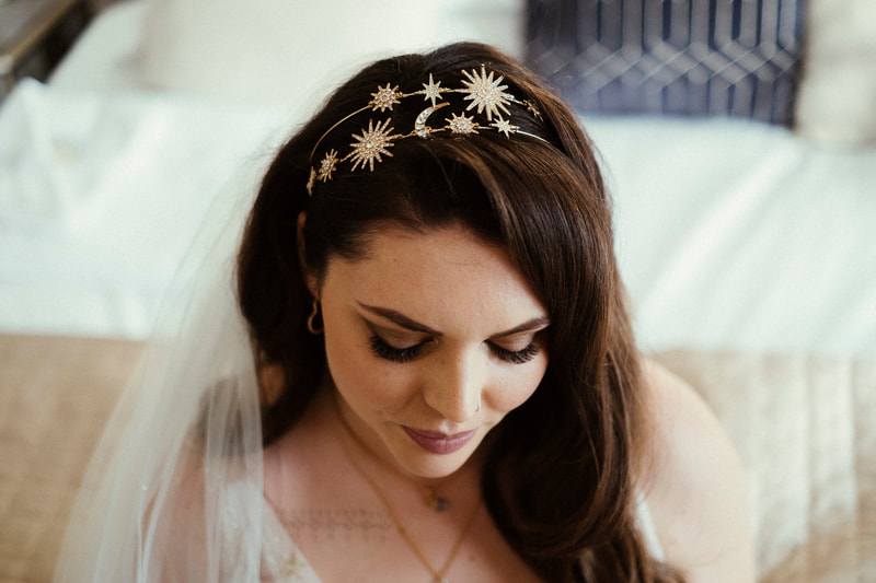 A bride with a tiara made from stars and moons
