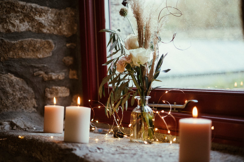 A floral display with candles
