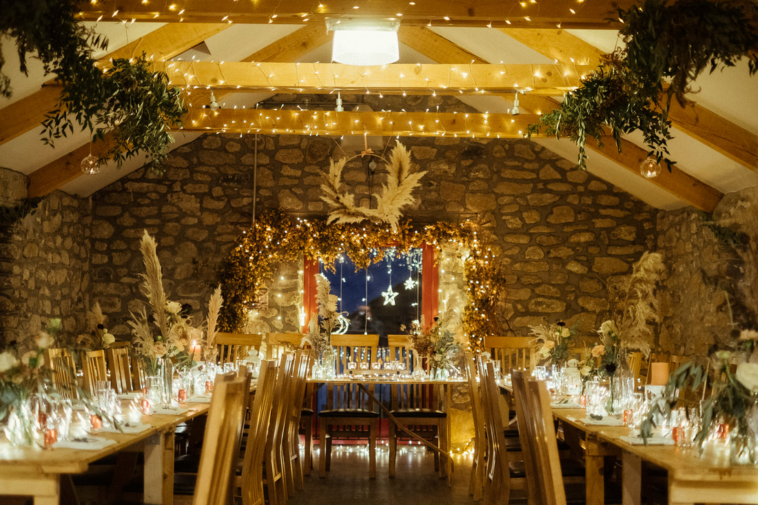 Upstairs in the Knightor Threshing Barn decorated for a winter inspired wedding reception.